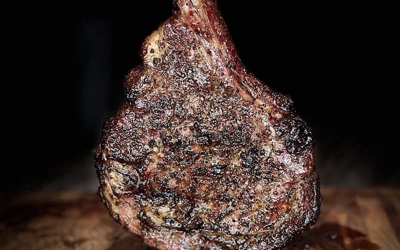 Smoked tomahawk ribeye with a peppercorn crust
